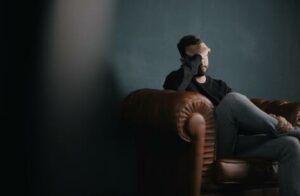 Depressed man on couch